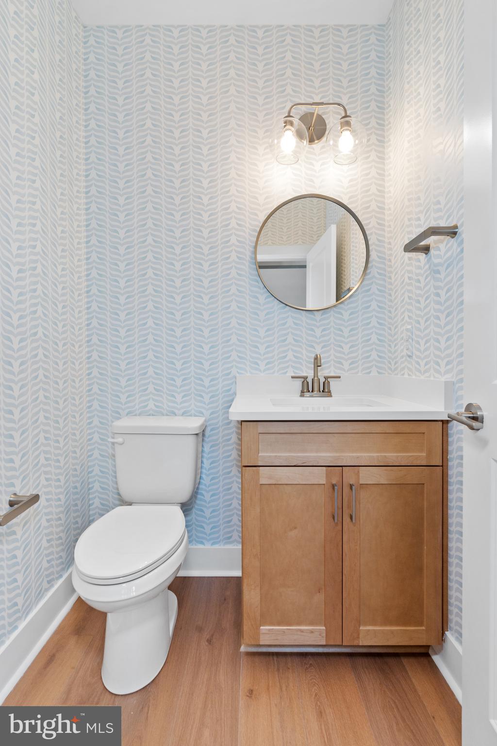 22580 Hummingbird Road, Unit 17 Ellendale, DE 19941 - Photo 28 of 75 a bathroom with a toilet sink and mirror