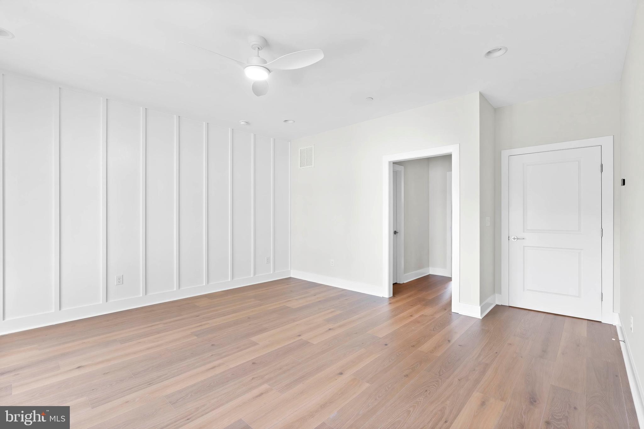 22580 Hummingbird Road, Unit 17 Ellendale, DE 19941 - Photo 30 of 75 a view of an empty room with wooden floor