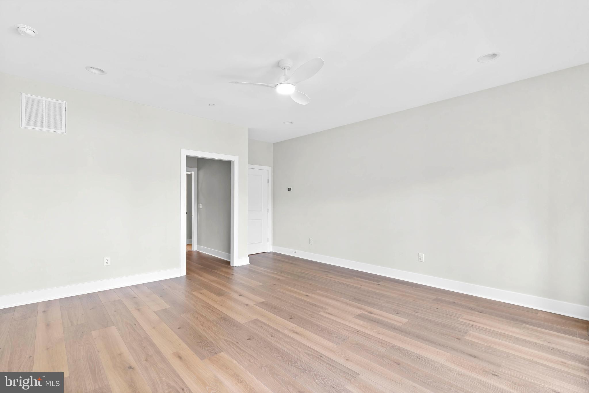 22580 Hummingbird Road, Unit 17 Ellendale, DE 19941 - Photo 31 of 75 a view of an empty room with wooden floor