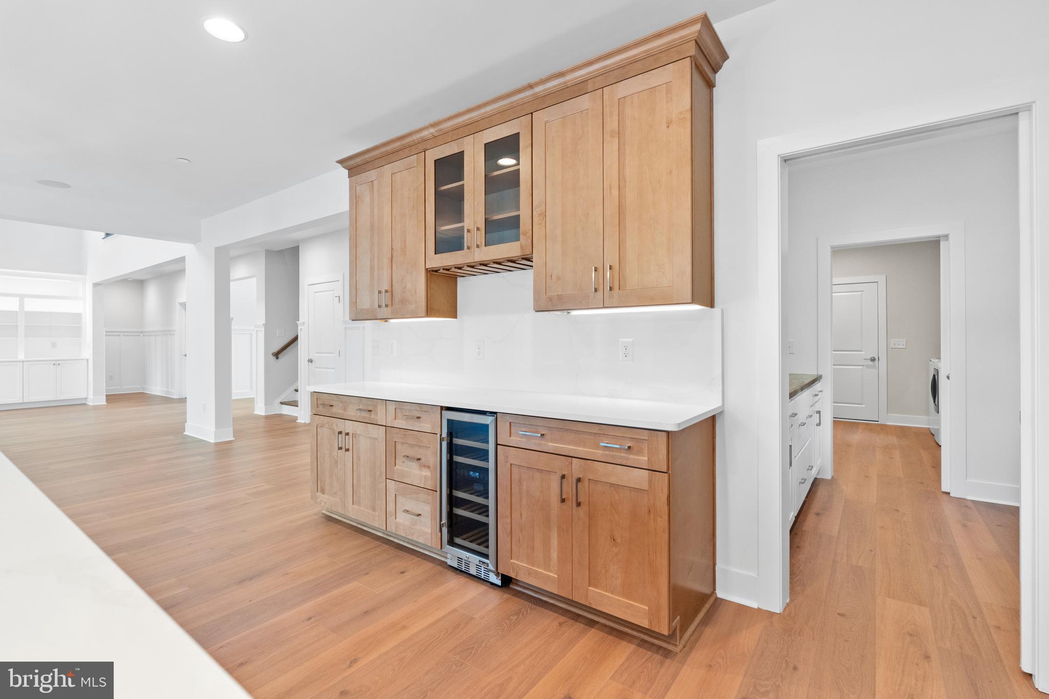 22580 Hummingbird Road, Unit 17 Ellendale, DE 19941 - Photo 32 of 75 a kitchen with stainless steel appliances granite countertop a stove and a wooden floors