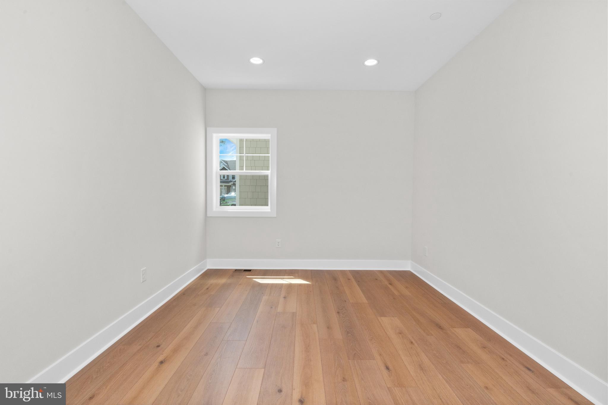 22580 Hummingbird Road, Unit 17 Ellendale, DE 19941 - Photo 34 of 75 a view of a room with wooden floor and window
