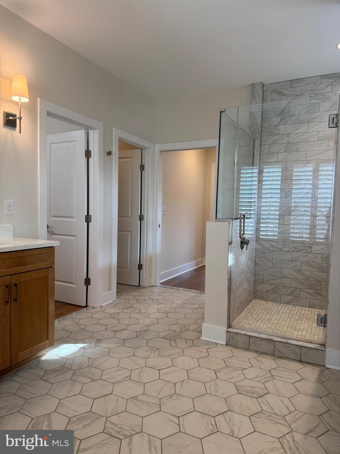 22580 Hummingbird Road, Unit 17 Ellendale, DE 19941 - Photo 61 of 75 a view of a bathroom with a sink and a shower