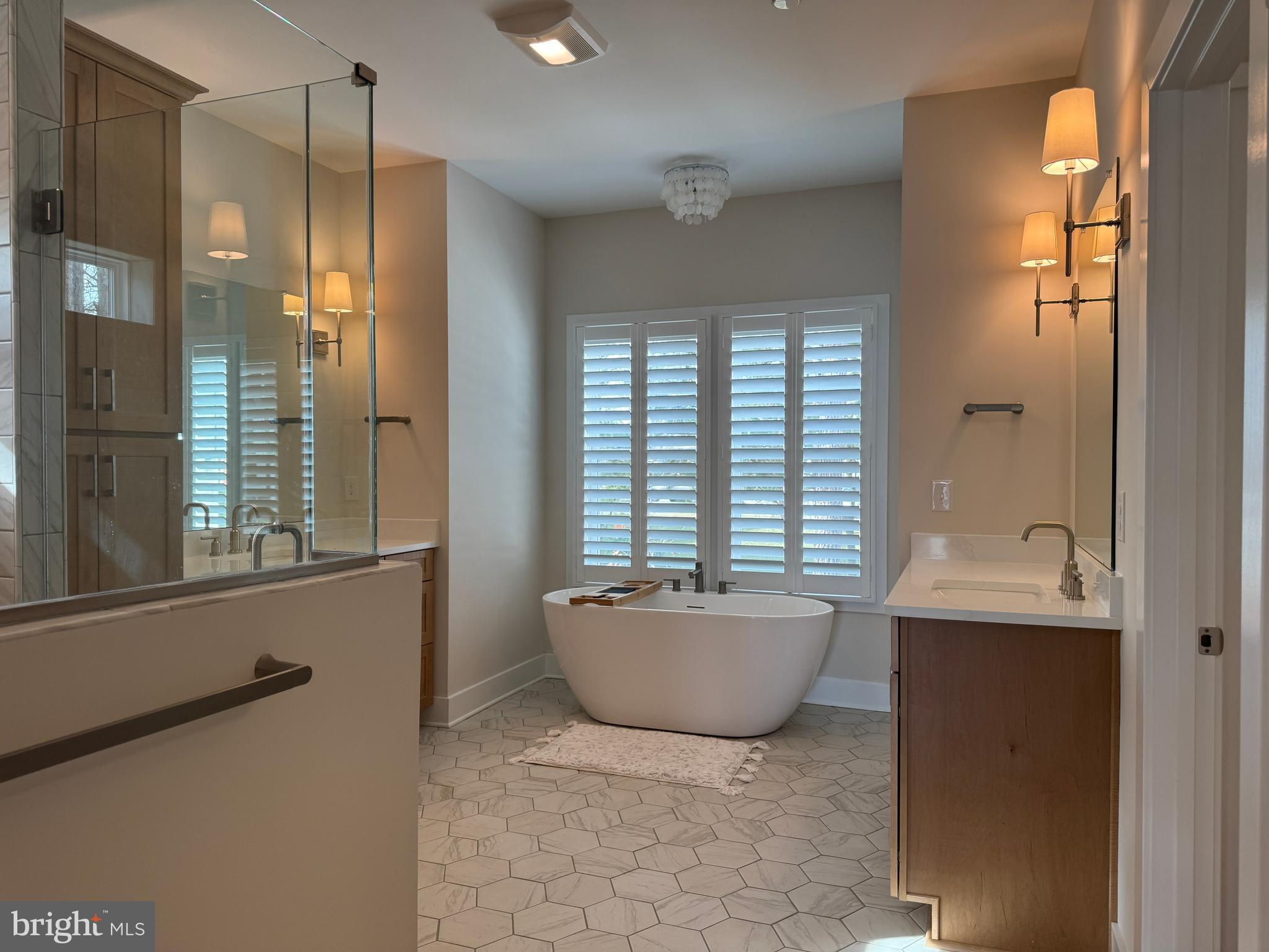 22580 Hummingbird Road, Unit 17 Ellendale, DE 19941 - Photo 63 of 75 a bathroom with a granite countertop sink mirror bathtub and shower