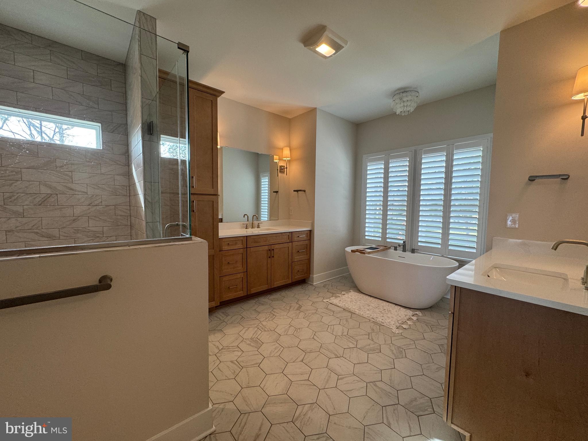 22580 Hummingbird Road, Unit 17 Ellendale, DE 19941 - Photo 65 of 75 a large bathroom with a tub a sink and mirror
