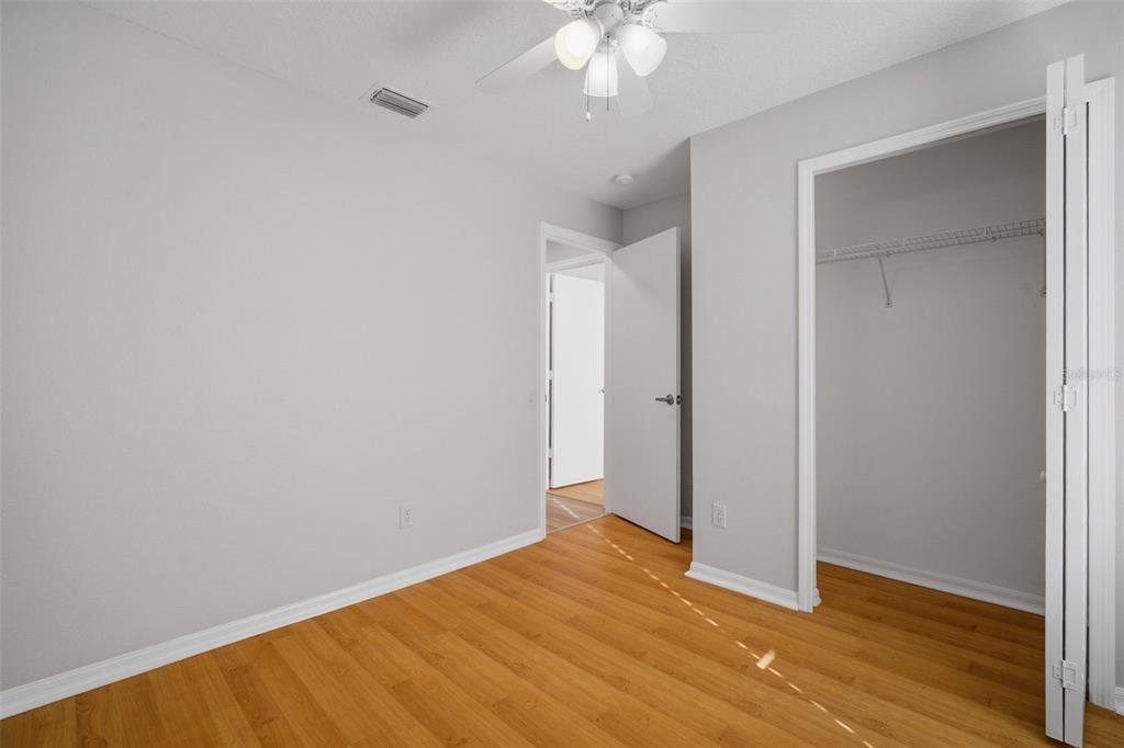 12407 Dawn Vista Drive Riverview, FL 33578 - Photo 14 of 44 a view of an empty room with wooden floor
