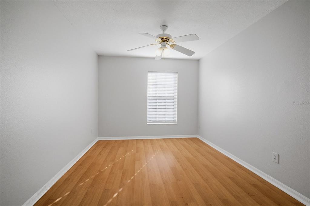 12407 Dawn Vista Drive Riverview, FL 33578 - Photo 17 of 44 wooden floor in an empty room with a window
