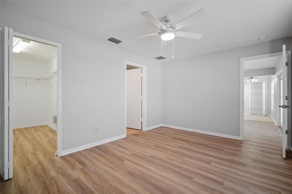 12407 Dawn Vista Drive Riverview, FL 33578 - Photo 23 of 44 wooden floor in an empty room with a window