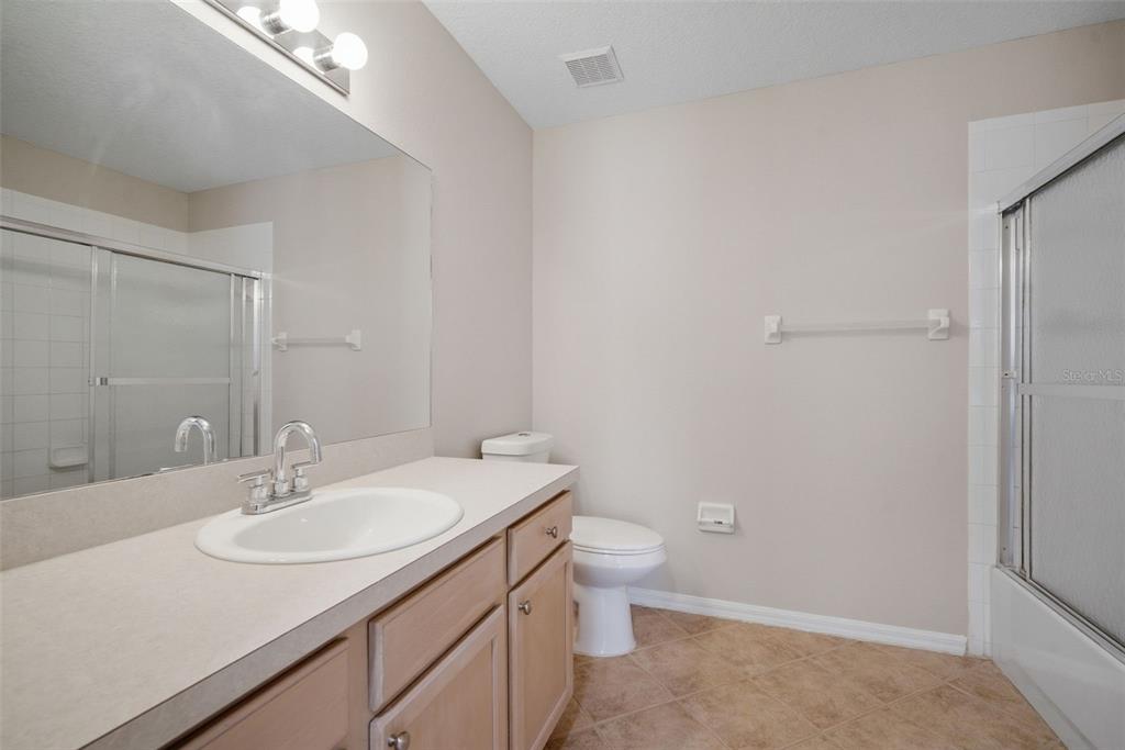 12407 Dawn Vista Drive Riverview, FL 33578 - Photo 35 of 44 a bathroom with a sink toilet and a mirror