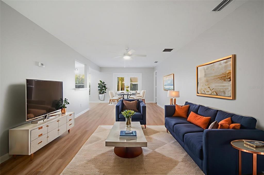 12407 Dawn Vista Drive Riverview, FL 33578 - Photo 6 of 44 a living room with furniture and a flat screen tv