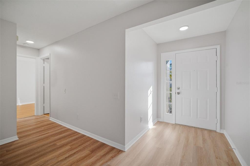 12407 Dawn Vista Drive Riverview, FL 33578 - Photo 9 of 44 a view of hallway with wooden floor