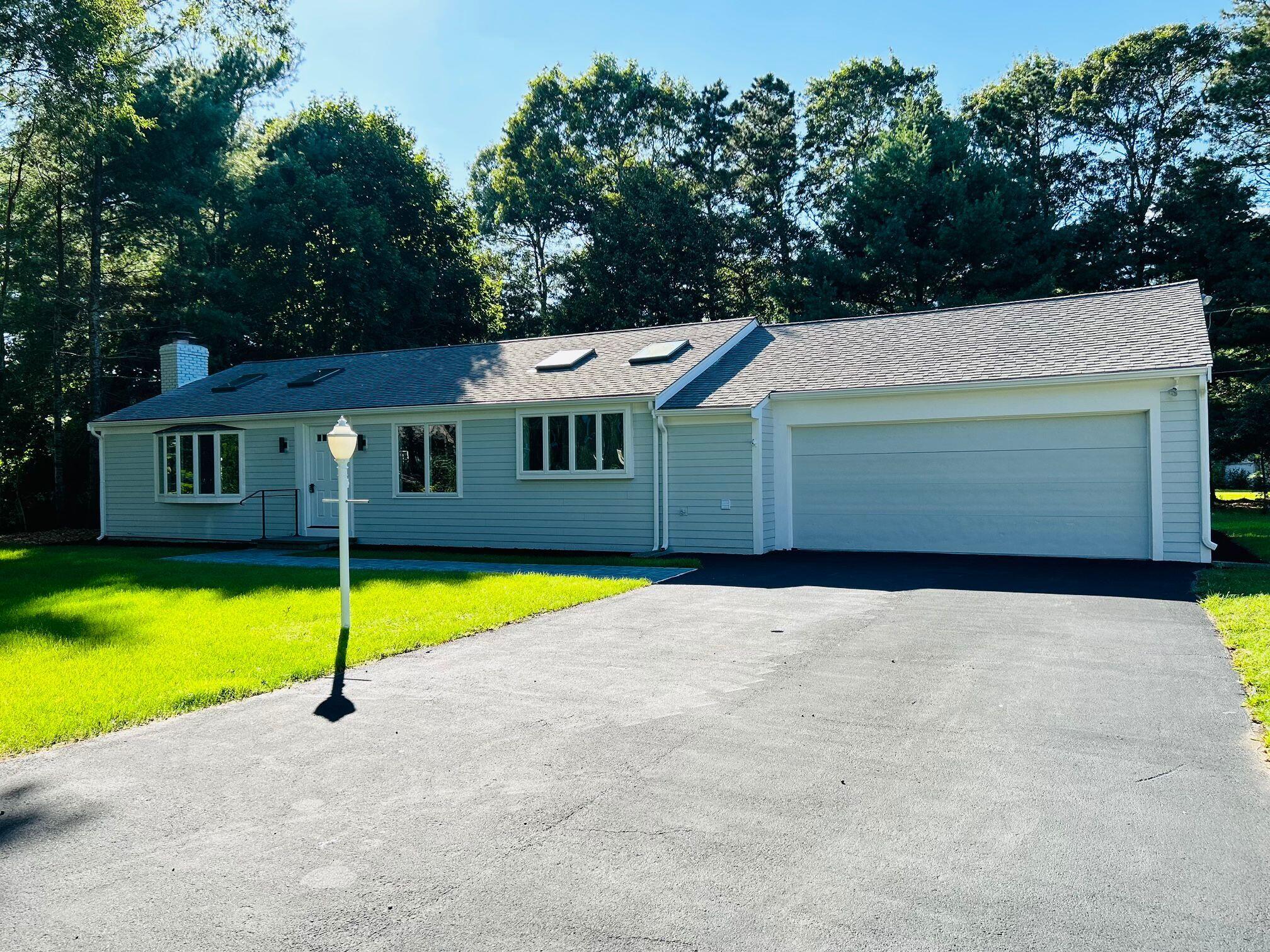 a front view of a house with a swimming pool