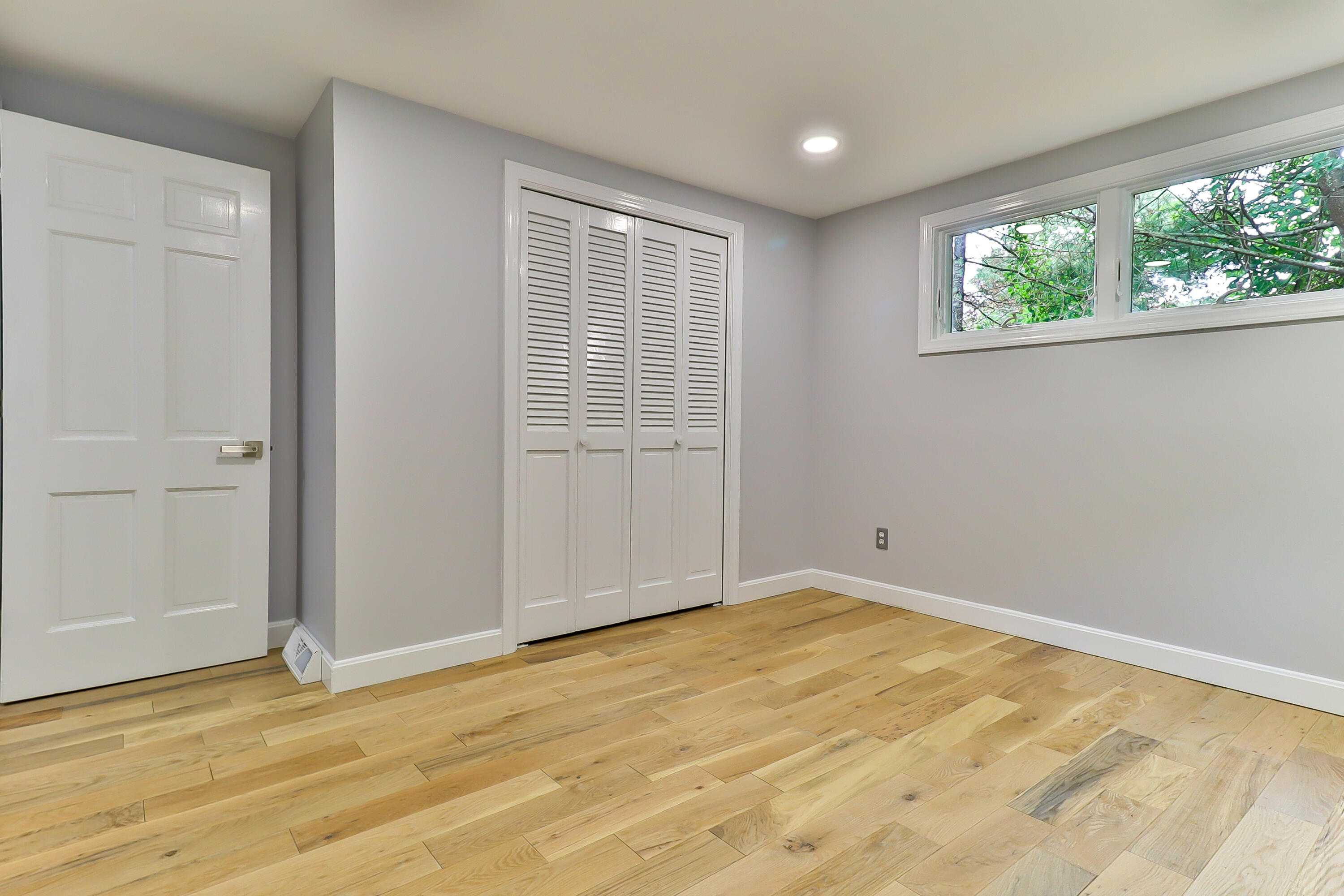 7 Guildford Road Centerville, MA 02632 - Photo 17 of 28 an empty room with wooden floor and windows