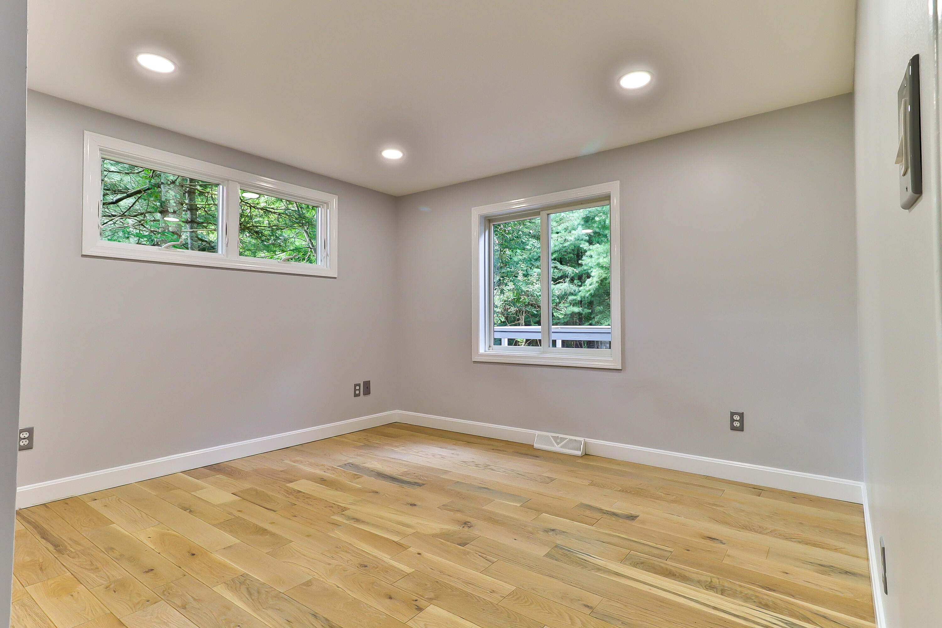 7 Guildford Road Centerville, MA 02632 - Photo 18 of 28 a view of an empty room with wooden floor and a window