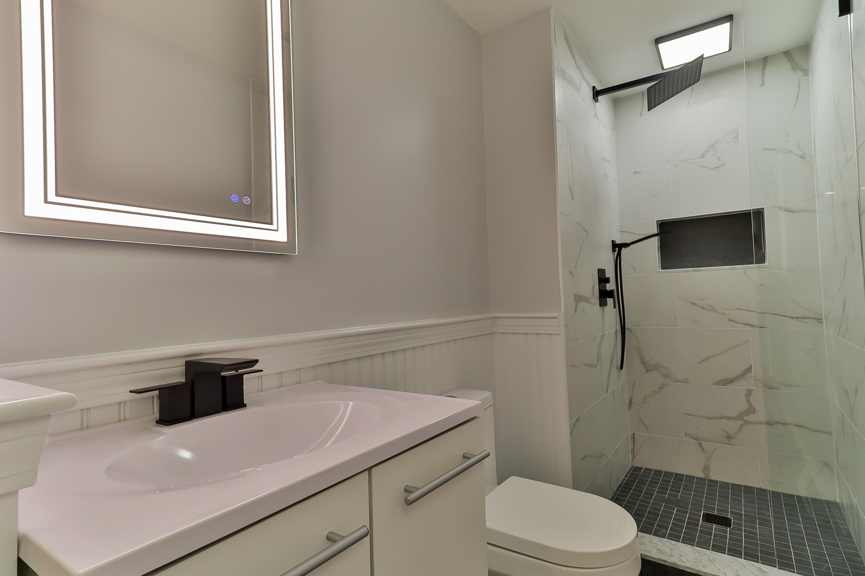 7 Guildford Road Centerville, MA 02632 - Photo 20 of 28 a bathroom with a sink a toilet and shower