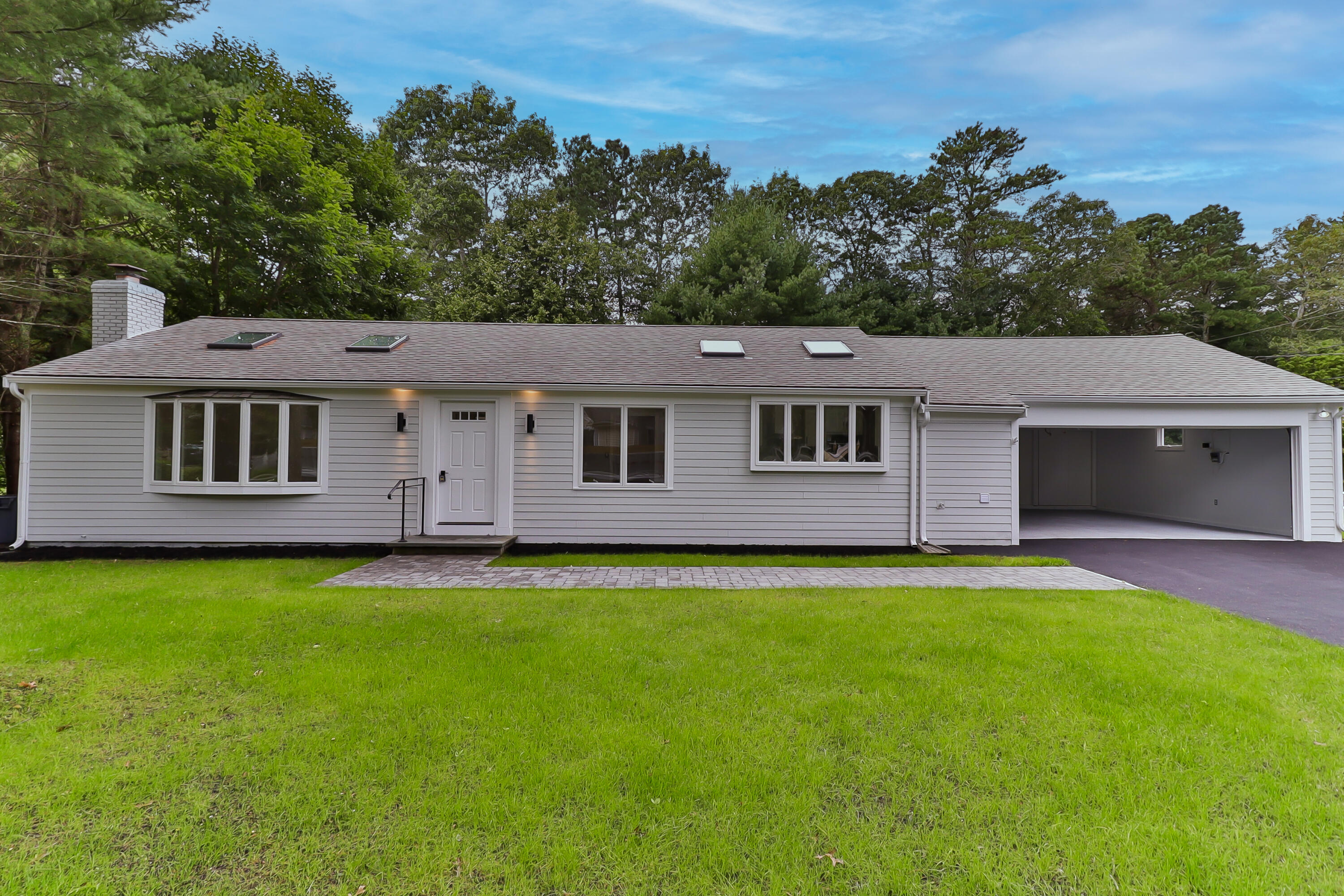 7 Guildford Road Centerville, MA 02632 - Photo 2 of 28 a aerial view of a house and a yard with green space