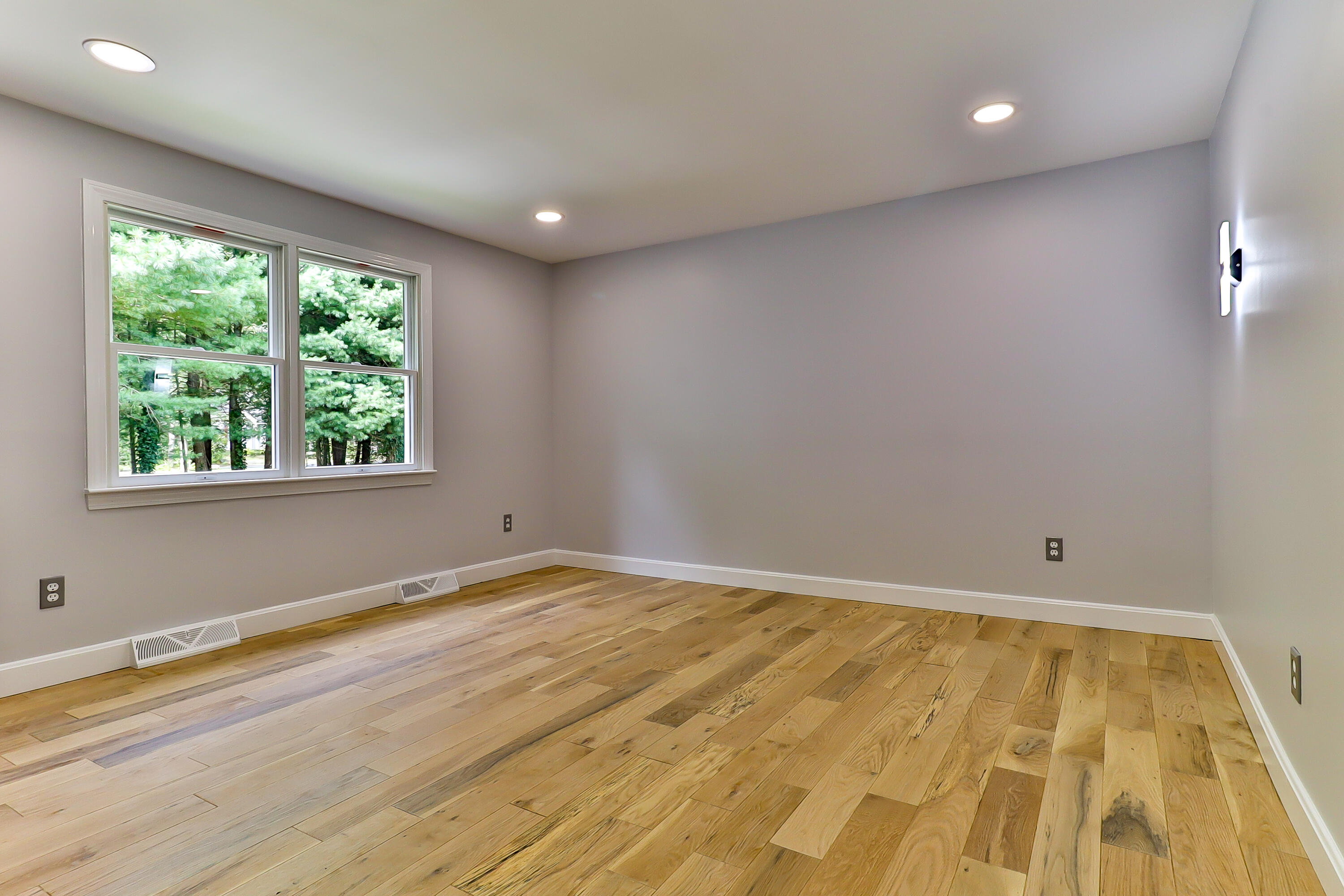 7 Guildford Road Centerville, MA 02632 - Photo 21 of 28 a view of an empty room with wooden floor and a window