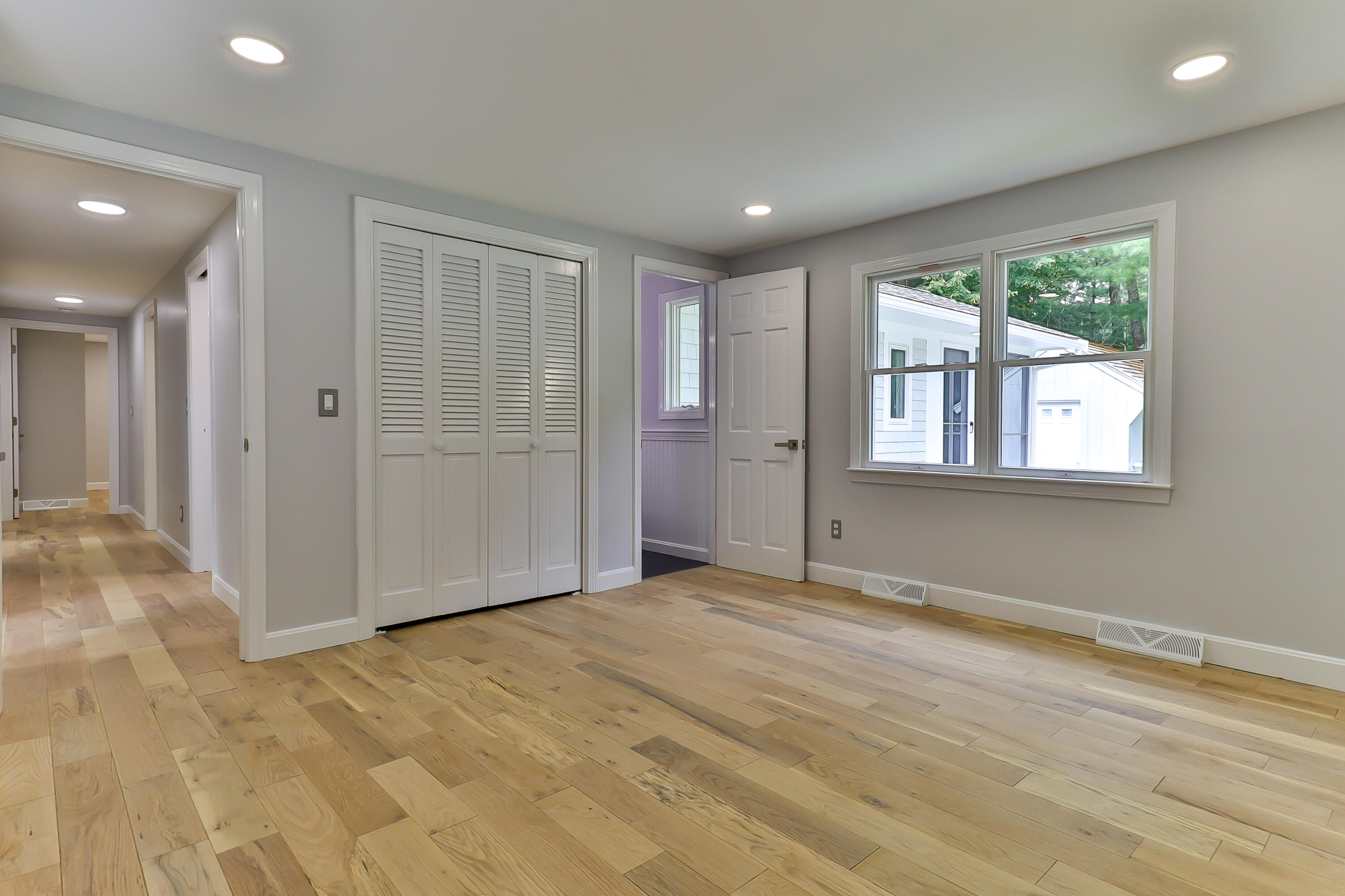 7 Guildford Road Centerville, MA 02632 - Photo 22 of 28 a view of an empty room with wooden floor and a window