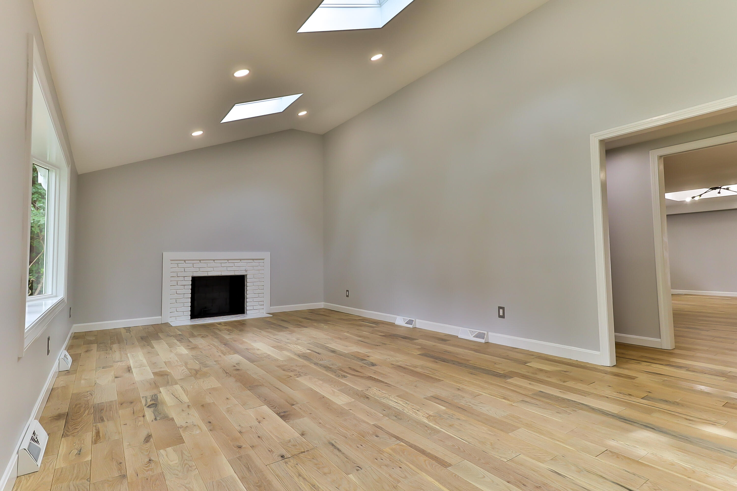 7 Guildford Road Centerville, MA 02632 - Photo 5 of 28 a view of empty room with wooden floor and fireplace