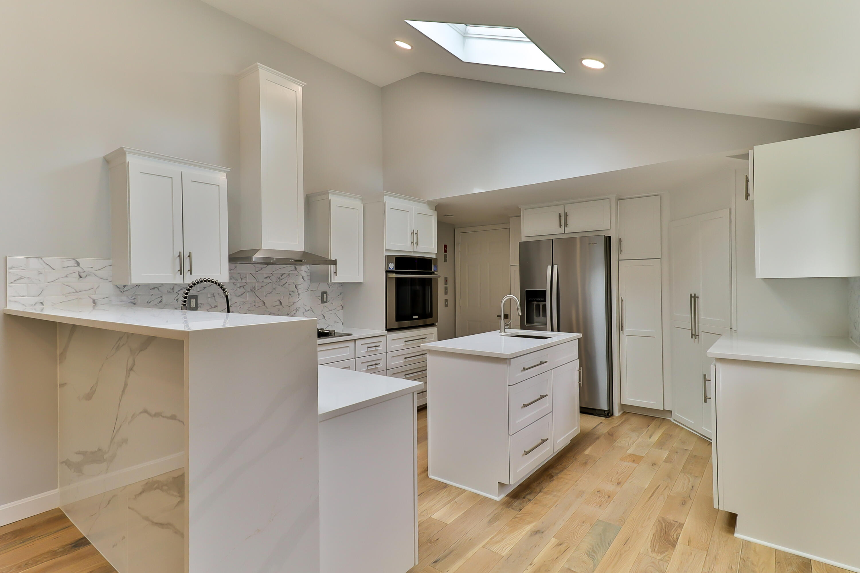 7 Guildford Road Centerville, MA 02632 - Photo 8 of 28 a large kitchen with a lot of counter space and wooden floor