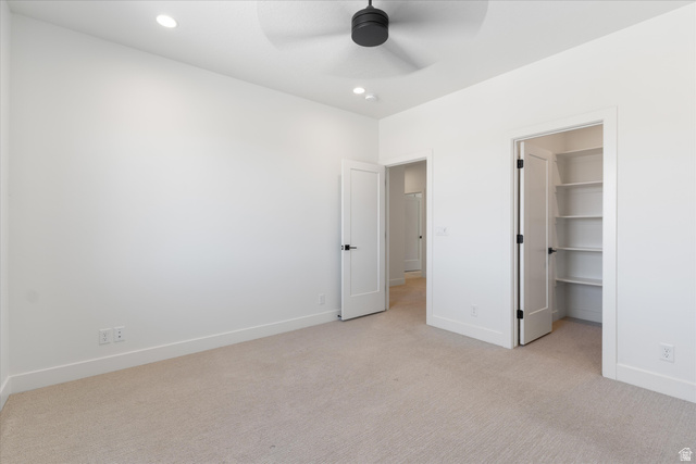 1192 East Corral Way Washington, UT 84780 - Photo 46 of 81 Spacious room featuring neutral carpeting, a black ceiling fan, and recessed lighting