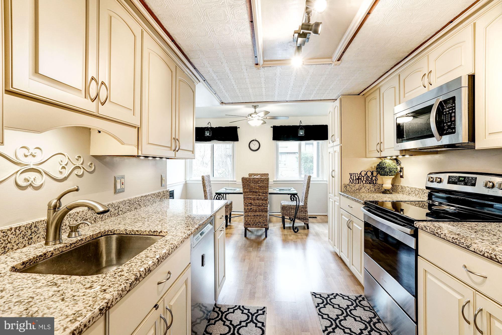 8552 Gwynedd Way Springfield, VA 22153 - Photo 12 of 37 Custom cabinets, granite, lots of storage