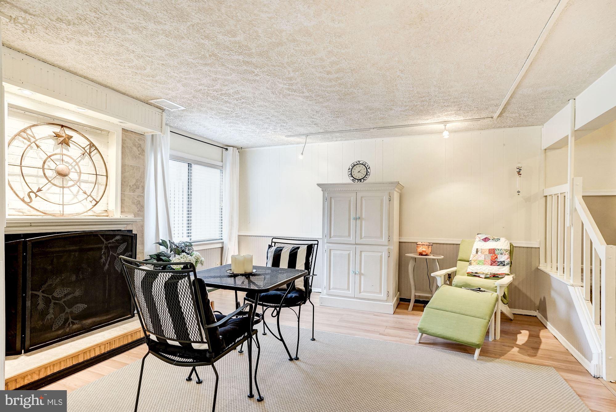 8552 Gwynedd Way Springfield, VA 22153 - Photo 21 of 37 Lower level family room w/ wood burning fireplace