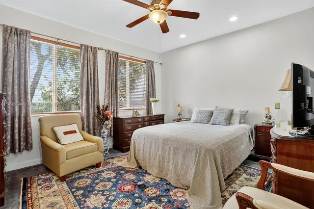 a bedroom with a bed and a couch