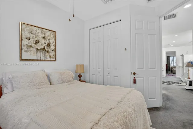 a bedroom with a bed and a walk in closet