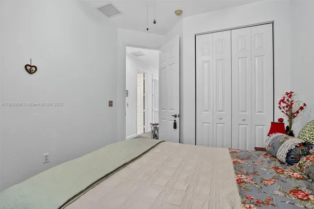 a bedroom with a bed and a closet