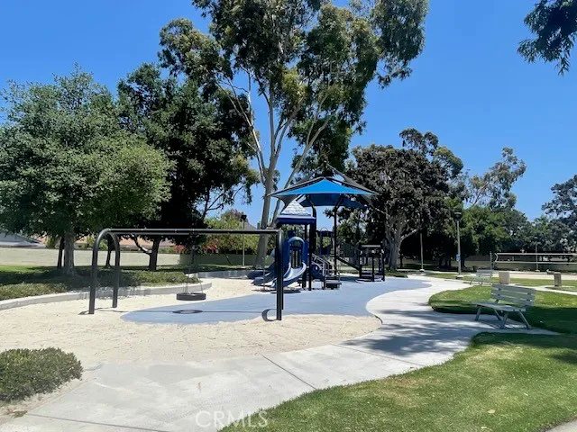 a view of a park with large trees
