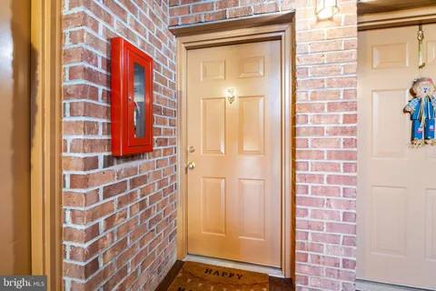a bathroom with a shower and a glass door