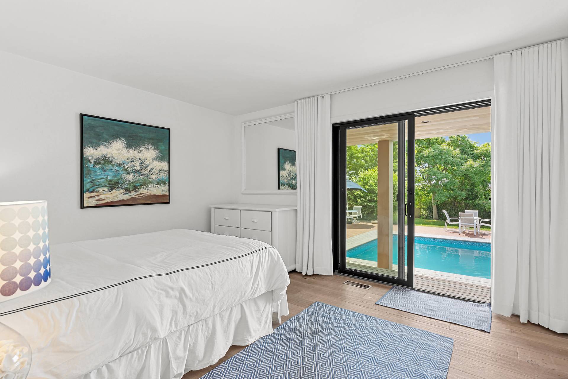 11 Fairview Road Montauk, NY 11954 - Photo 14 of 38 a bedroom with a large bed and a large window