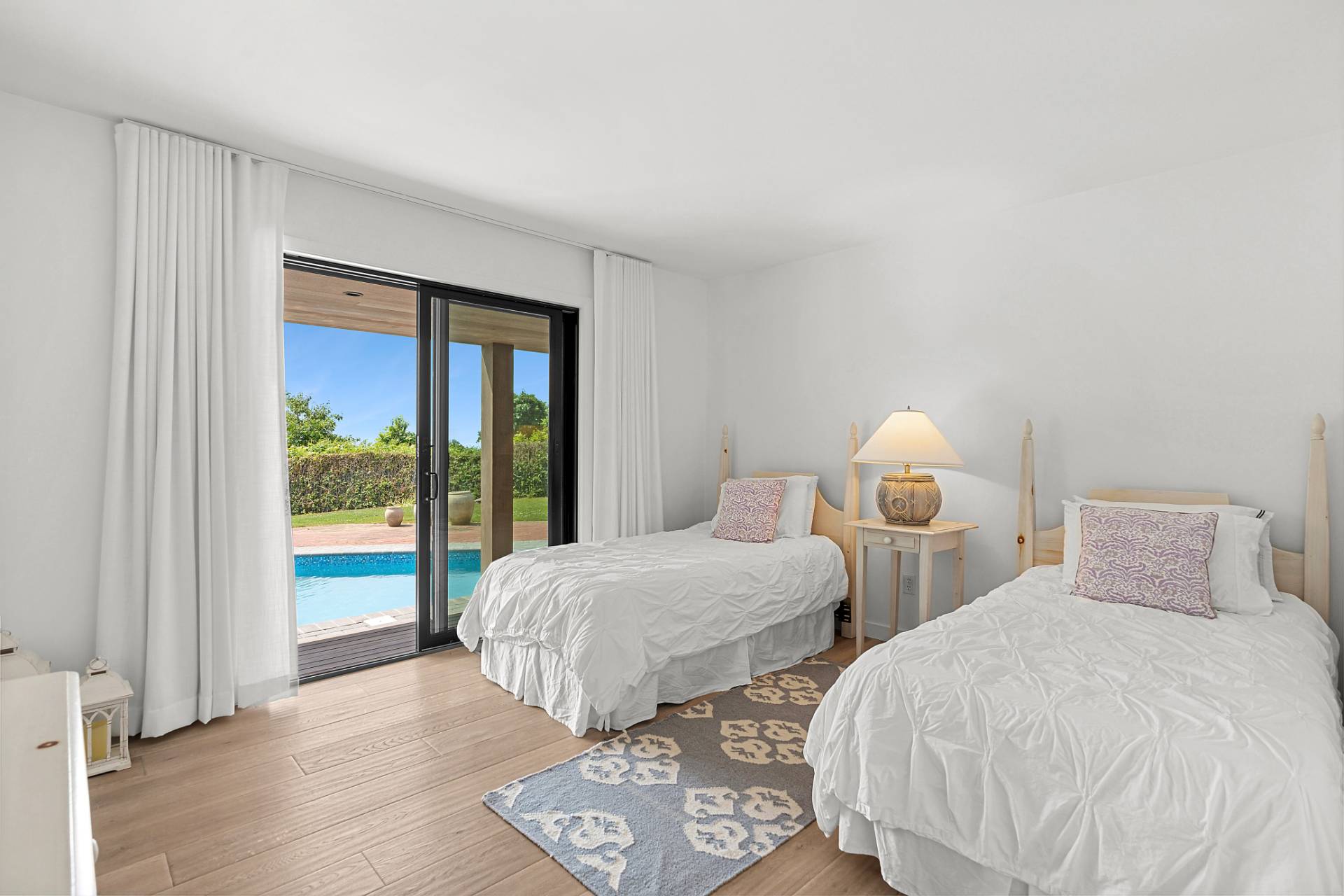 11 Fairview Road Montauk, NY 11954 - Photo 17 of 38 a bedroom with two beds and a large window