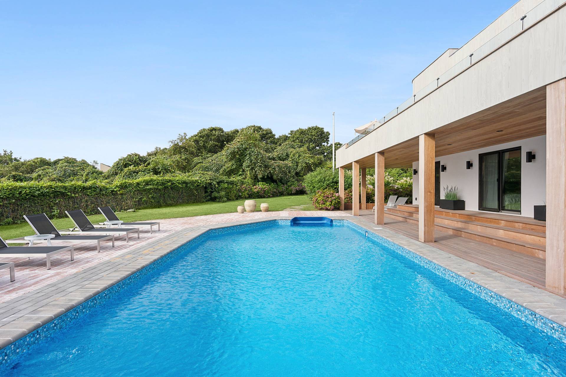 11 Fairview Road Montauk, NY 11954 - Photo 3 of 38 a view of a swimming pool with an outdoor seating