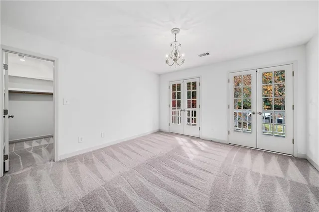 a view of a balcony with wooden floor and fence