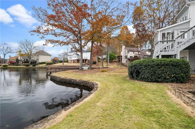 an aerial view of a house with a lake view
