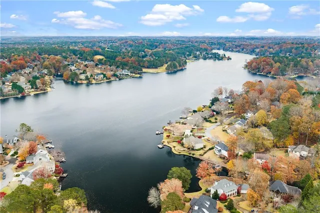a view of a house with swimming pool and sitting area