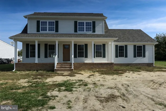 a house with trees in the background