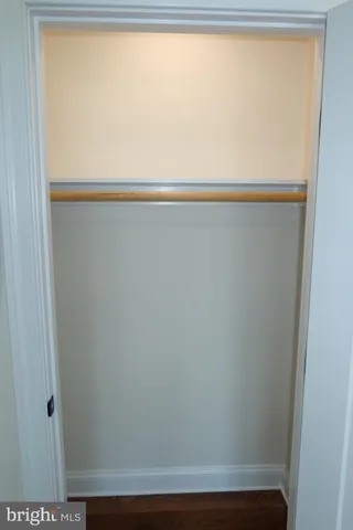 a view of wooden floor and windows in a room