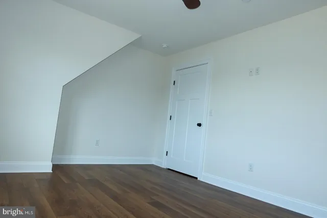 a bathroom with a double vanity sink mirror and toilet