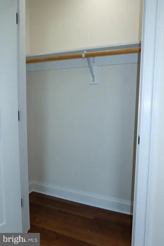 a bathroom with double vanity sinks and a mirror