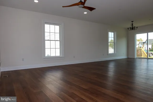 a view of a kitchen with wooden floor