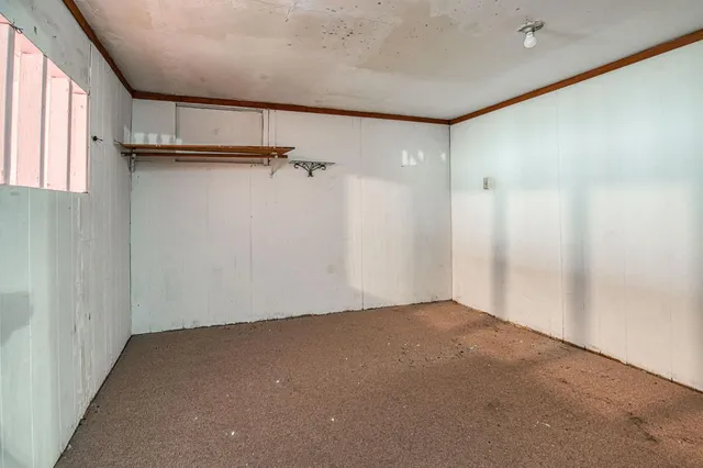 a bathroom with a sink a toilet a mirror and shower