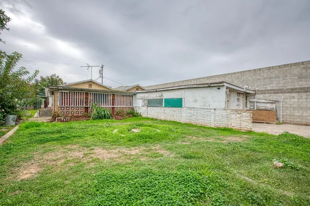 a front view of a house with a yard and porch