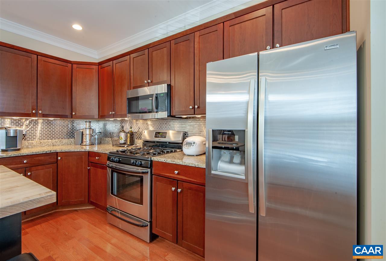 335 Quarry Road Charlottesville, VA 22902 - Photo 11 of 36 a kitchen with a refrigerator sink and cabinets