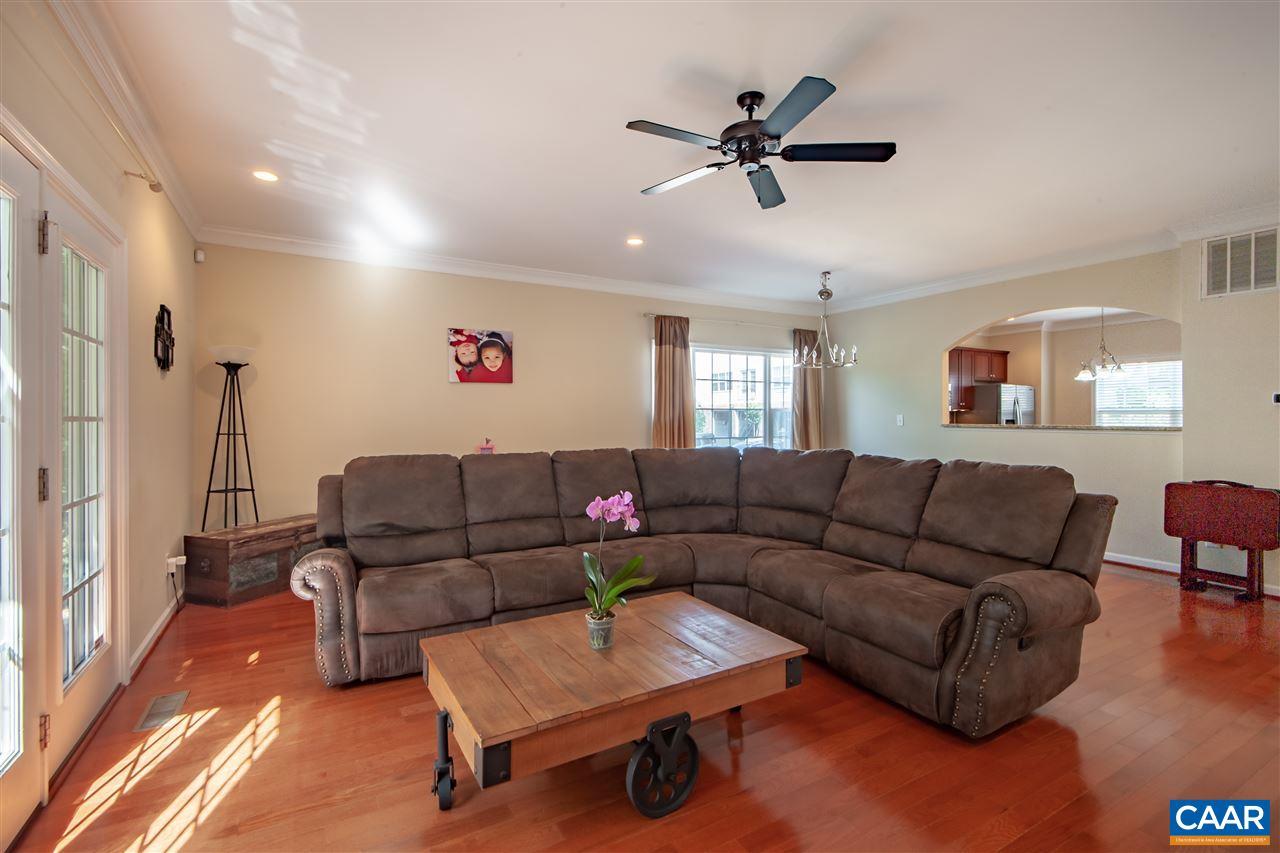 335 Quarry Road Charlottesville, VA 22902 - Photo 14 of 36 a living room with furniture and a wooden floor