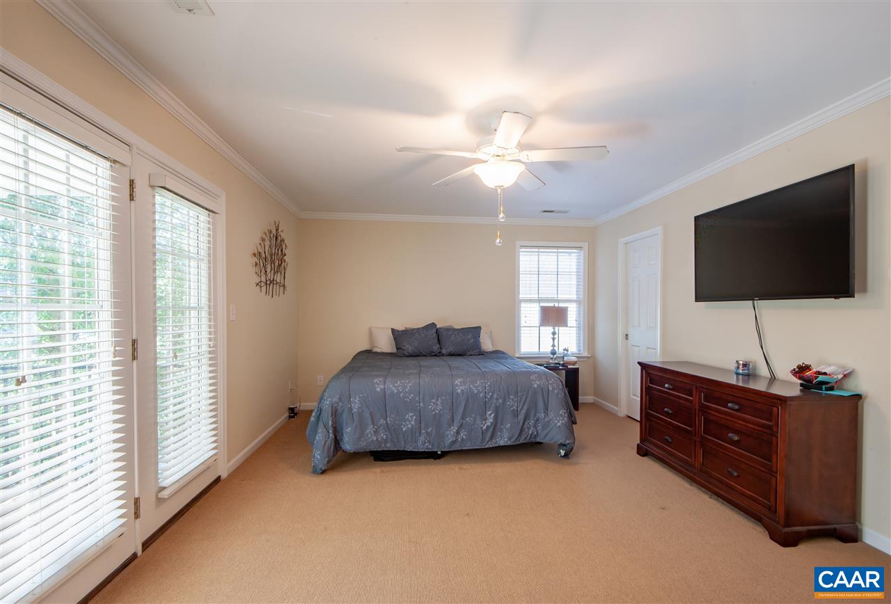 335 Quarry Road Charlottesville, VA 22902 - Photo 17 of 36 a living room with furniture and a flat screen tv