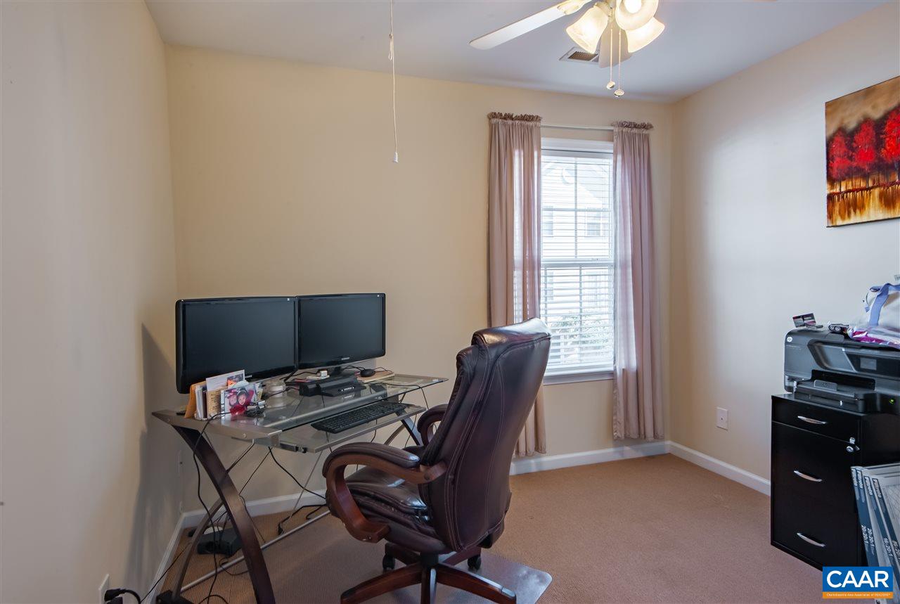 335 Quarry Road Charlottesville, VA 22902 - Photo 23 of 36 a view of a workspace with furniture and a window