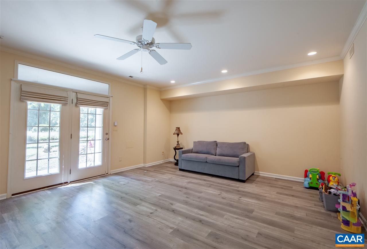 335 Quarry Road Charlottesville, VA 22902 - Photo 28 of 36 a living room with furniture and a wooden floor