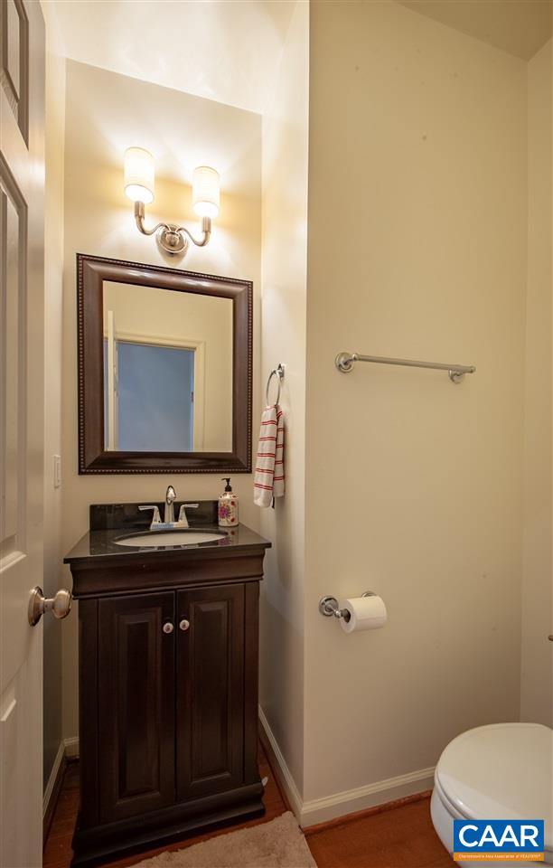 335 Quarry Road Charlottesville, VA 22902 - Photo 8 of 36 a bathroom with a toilet sink and mirror